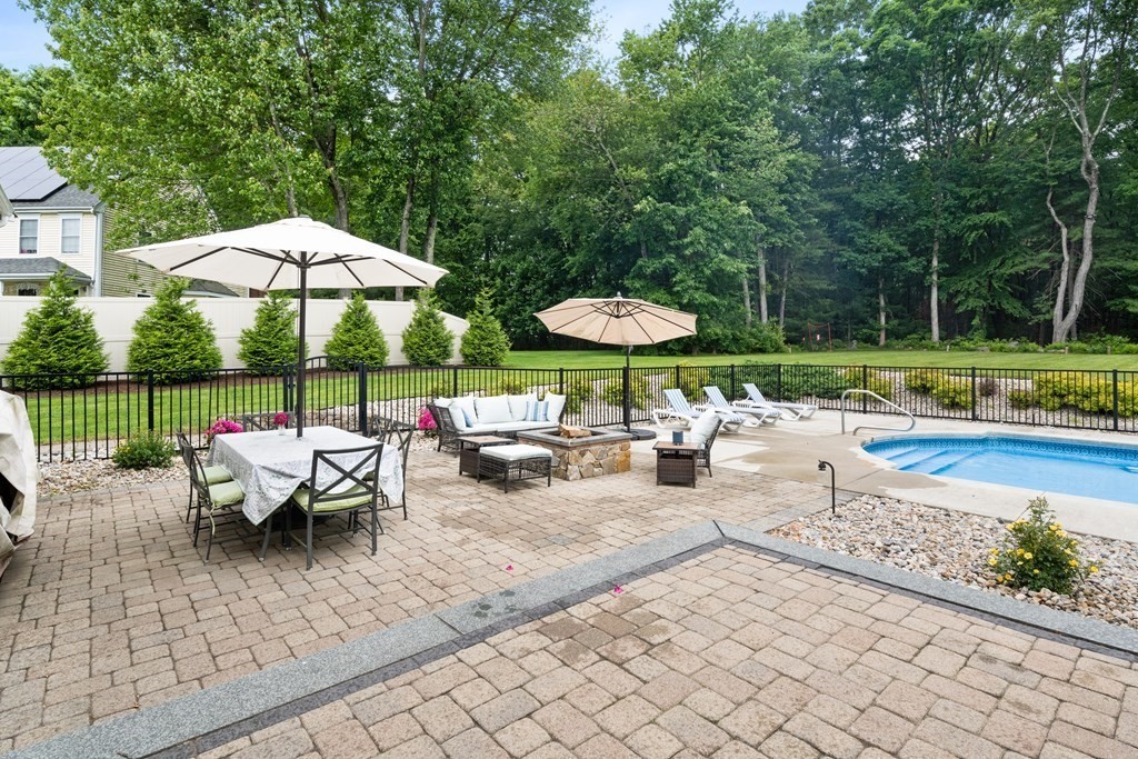 50 Pennock Road Ashland, MA 01721 - Photo 38 of 42 an outdoor space with furniture and umbrella