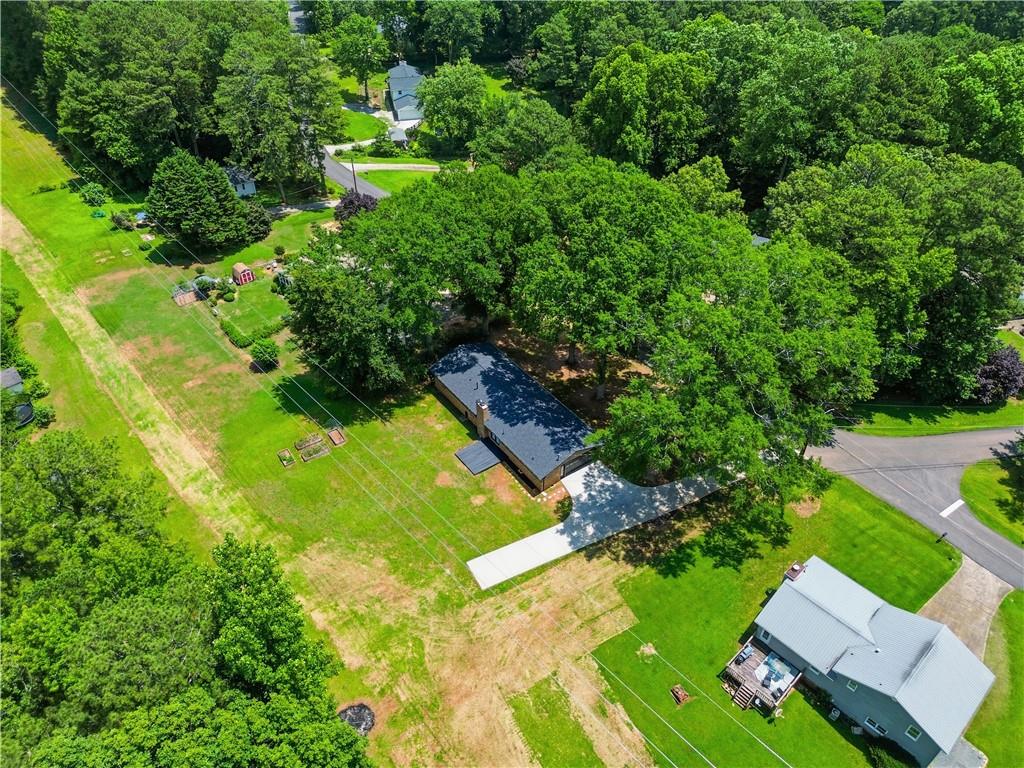 125 Childers Road Canton, GA 30115 - Photo 46 of 48 an aerial view of residential houses with yard