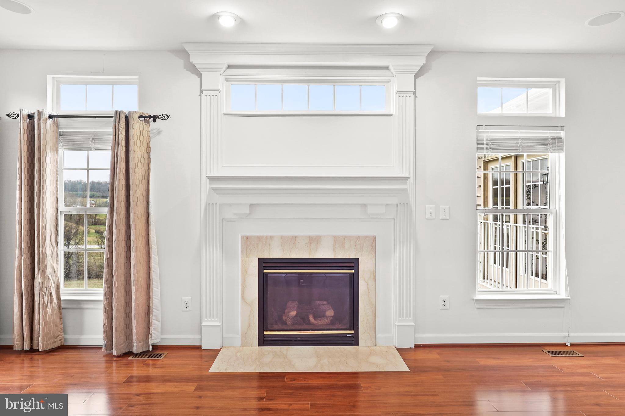 28 Fawn Hill Road Hanover, PA 17331 - Photo 15 of 69 a living room with a fireplace and wooden floor