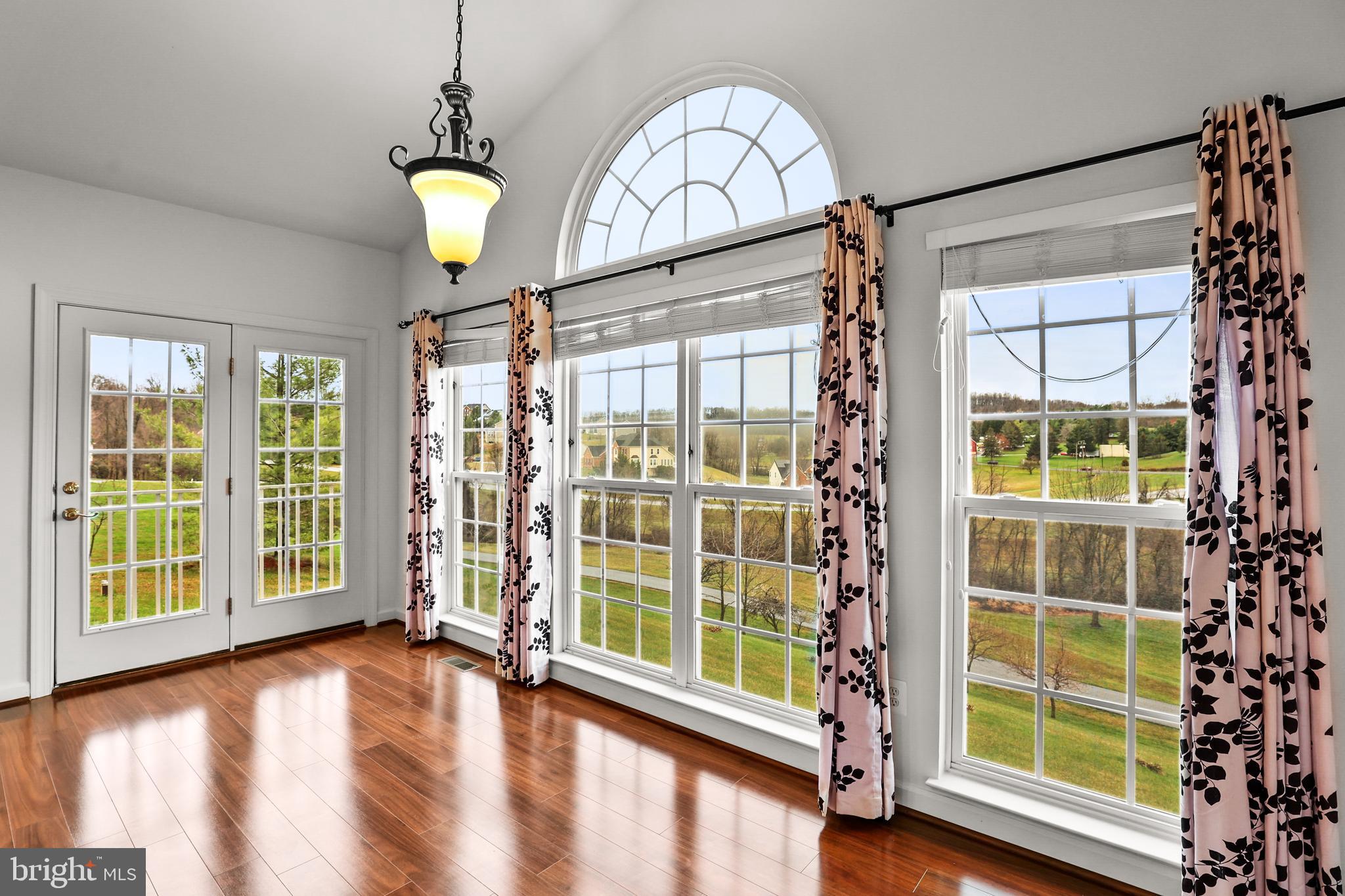 28 Fawn Hill Road Hanover, PA 17331 - Photo 25 of 69 a view of an empty room with a window and wooden floor