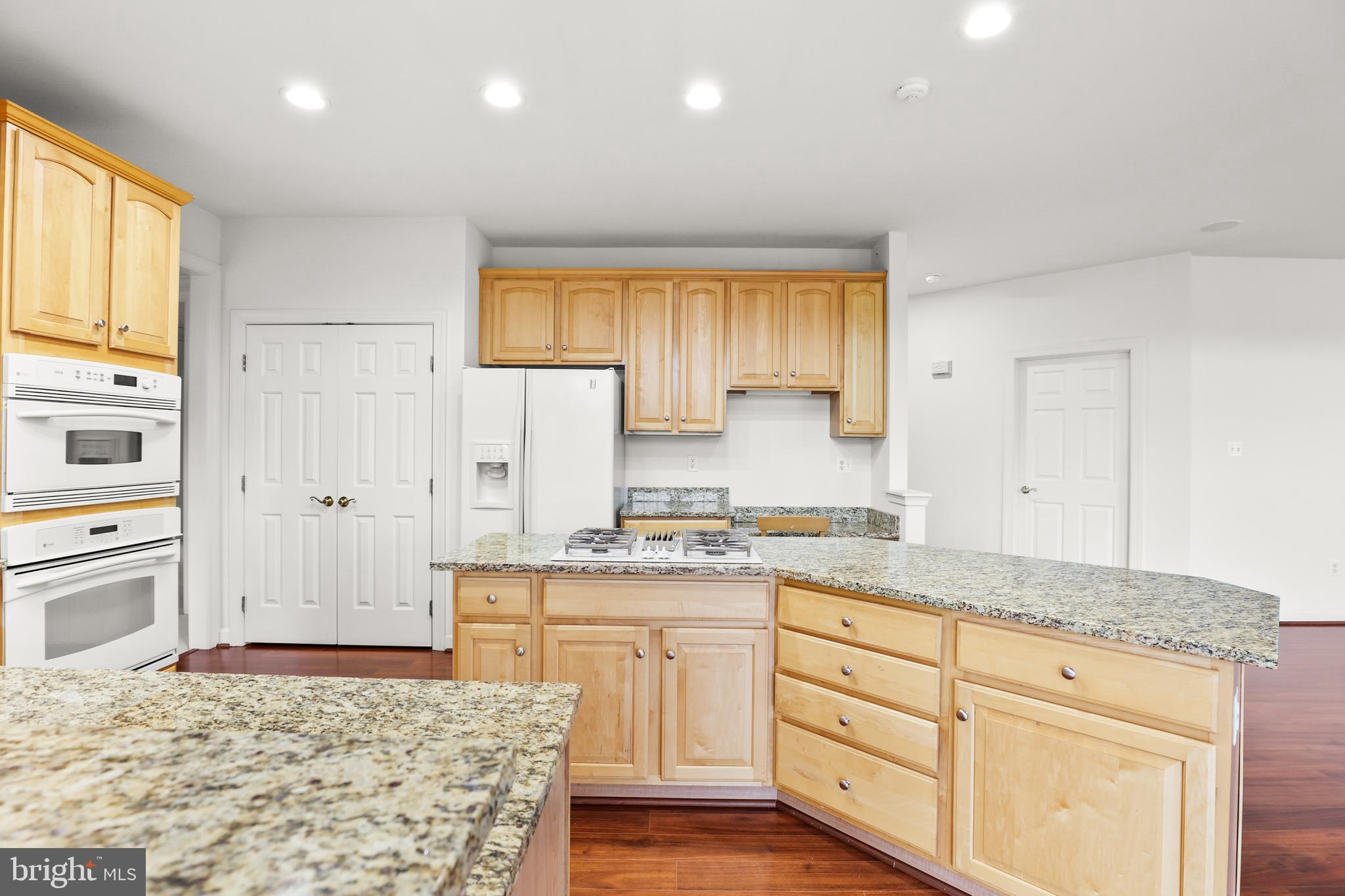 28 Fawn Hill Road Hanover, PA 17331 - Photo 26 of 69 a kitchen with granite countertop cabinets and wooden floor