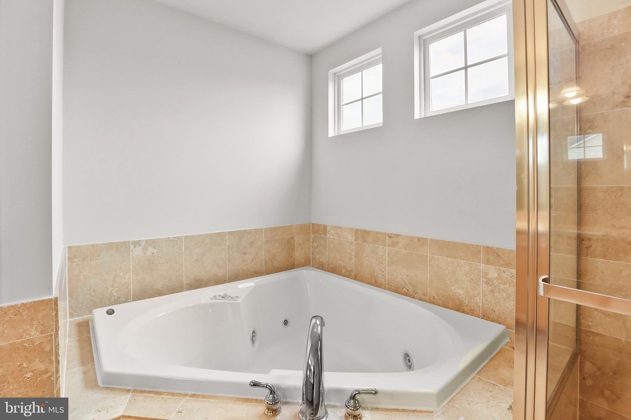 28 Fawn Hill Road Hanover, PA 17331 - Photo 39 of 69 a bath tub sitting in a bathroom next to a window