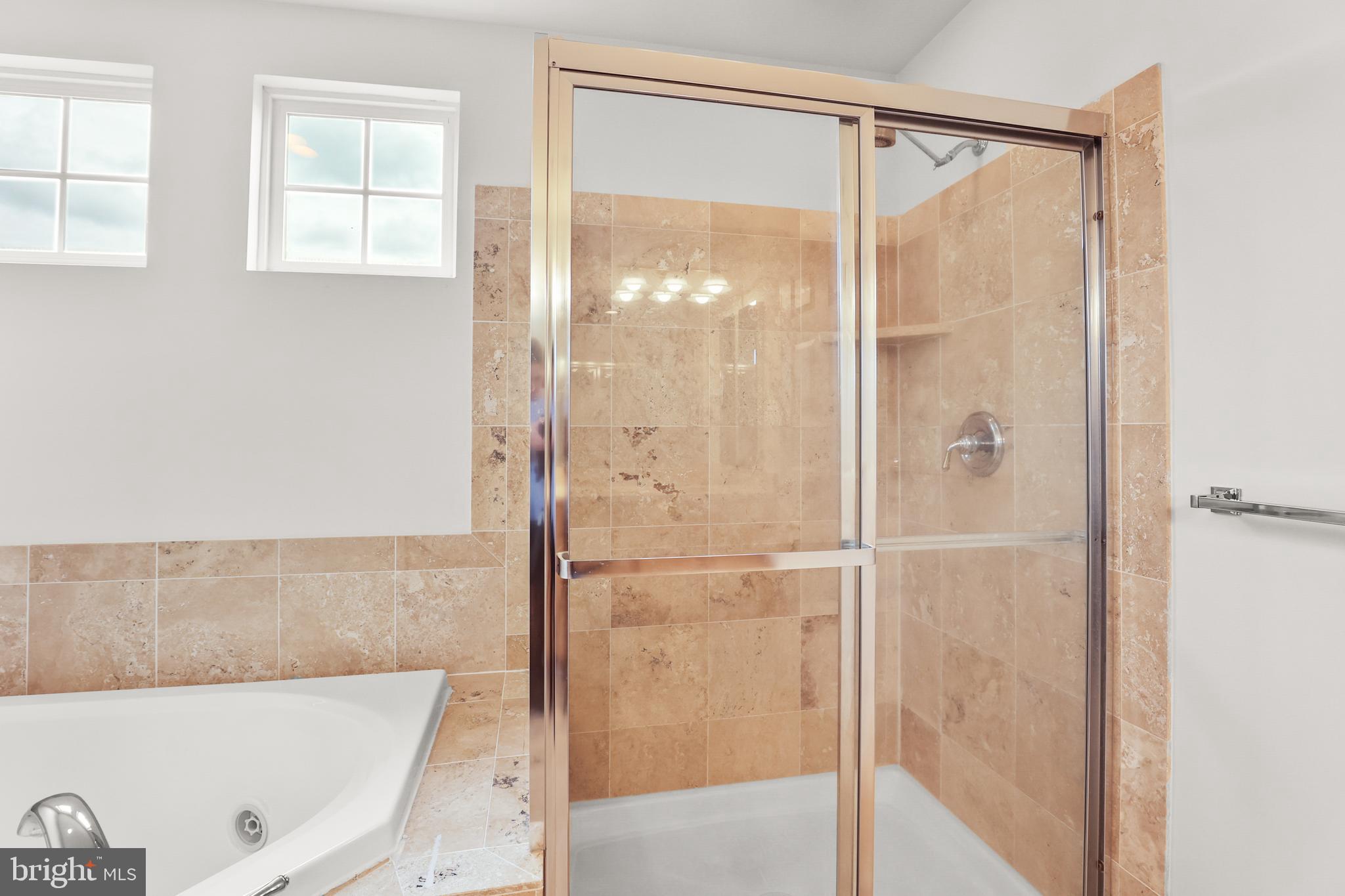 28 Fawn Hill Road Hanover, PA 17331 - Photo 41 of 69 a bathroom with a bathtub and a shower