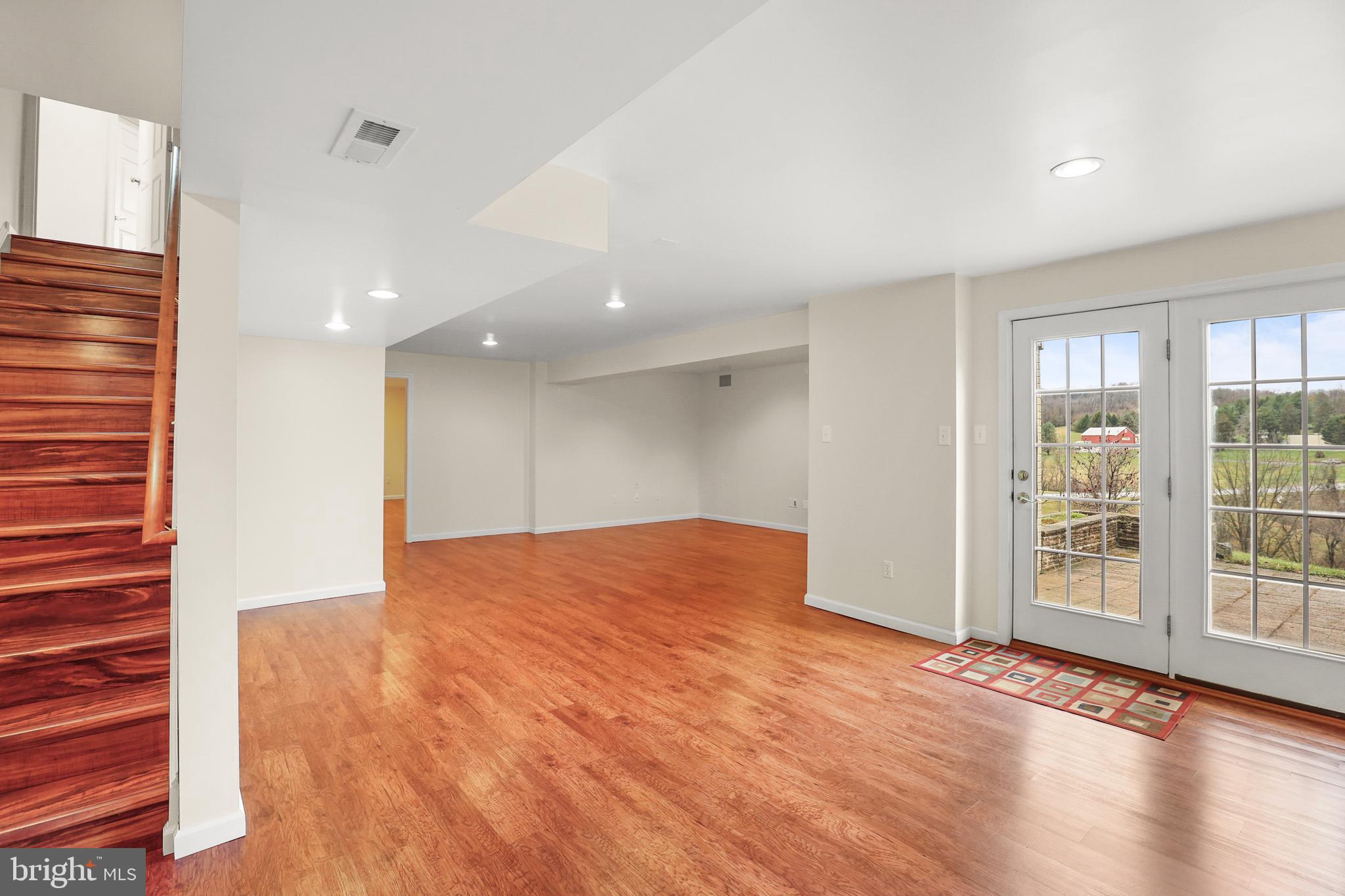 28 Fawn Hill Road Hanover, PA 17331 - Photo 52 of 69 a view of an empty room with wooden floor and a window