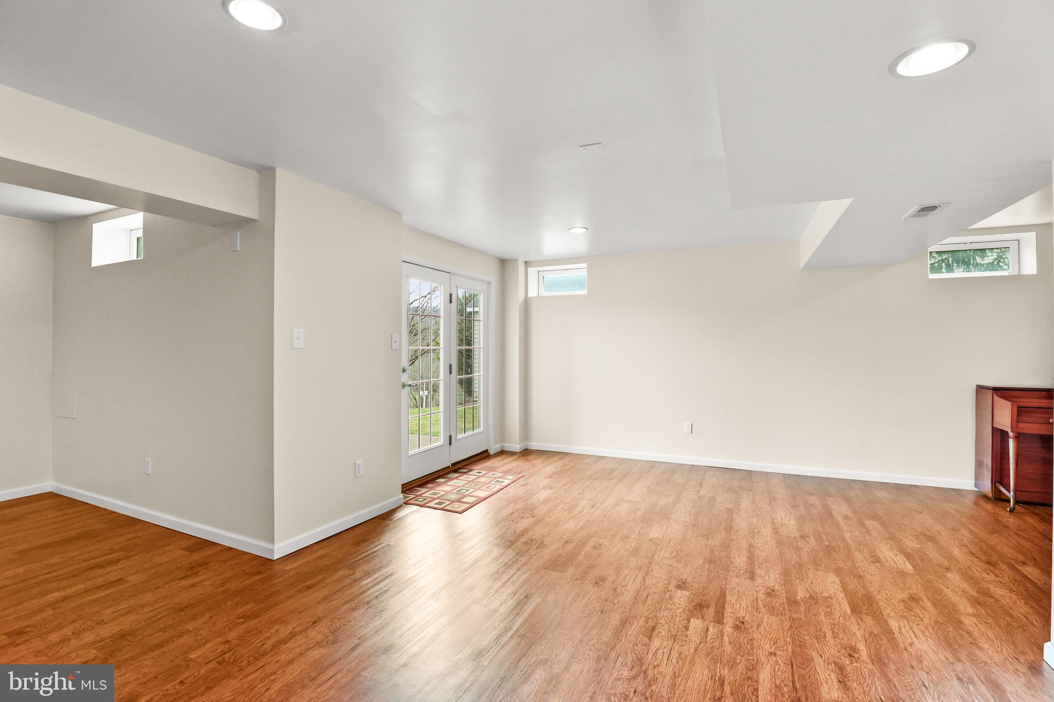28 Fawn Hill Road Hanover, PA 17331 - Photo 54 of 69 a view of an empty room with wooden floor and a window