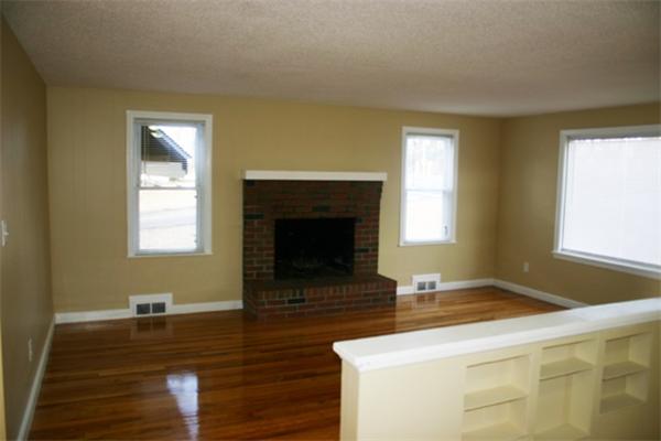 945 Wilbraham Road Springfield, MA 01109 - Photo 3 of 16 a living room with furniture and a fireplace