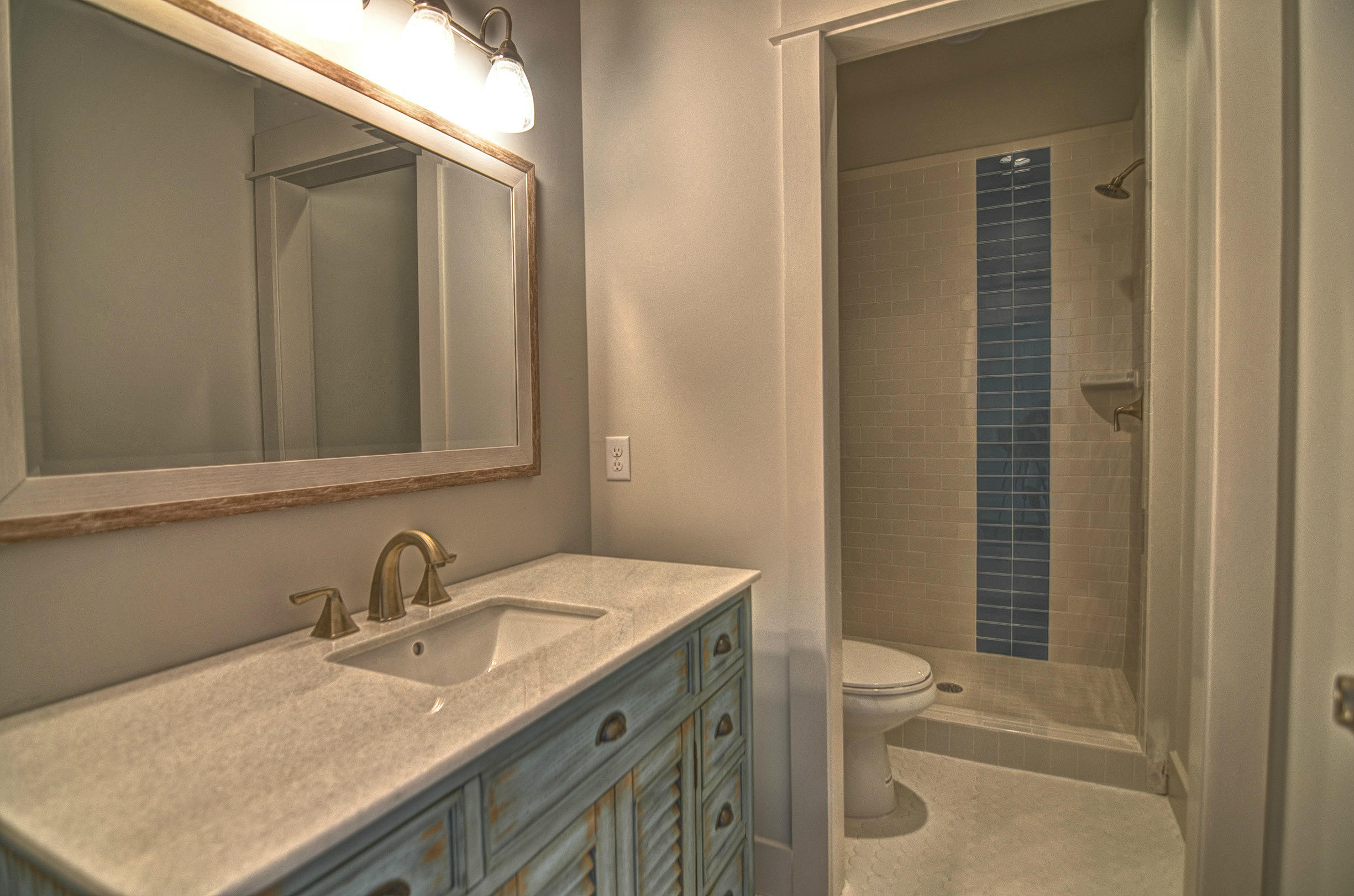 115 West Cobia Run Seacrest, FL 32461 - Photo 14 of 26 a bathroom with a sink a toilet and shower