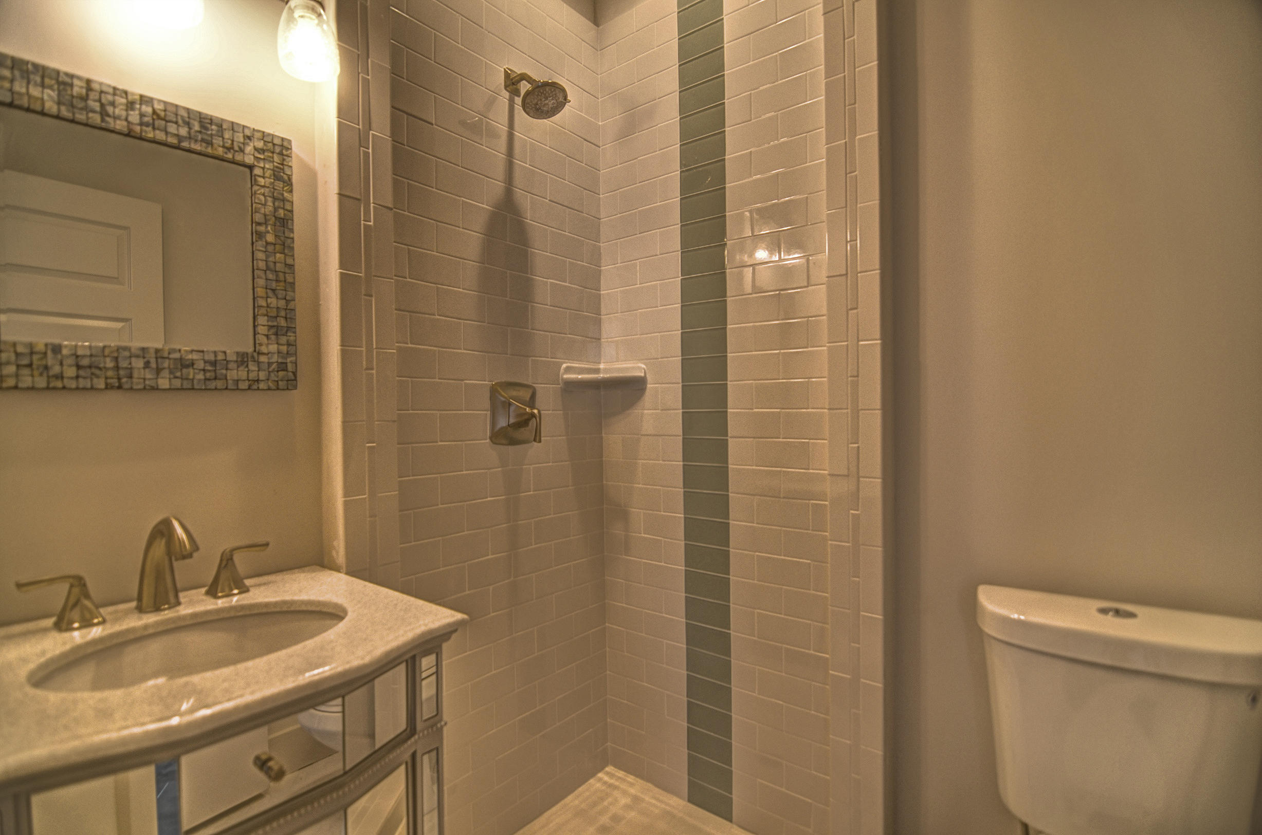 115 West Cobia Run Seacrest, FL 32461 - Photo 18 of 26 a bathroom with a granite countertop sink a toilet and shower