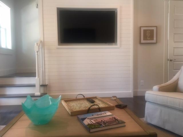 115 West Cobia Run Seacrest, FL 32461 - Photo 5 of 26 a living room with furniture and a flat screen tv