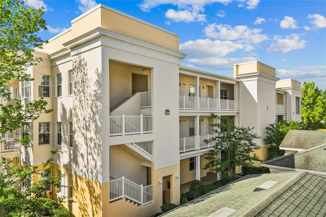 a view of a white building among the street