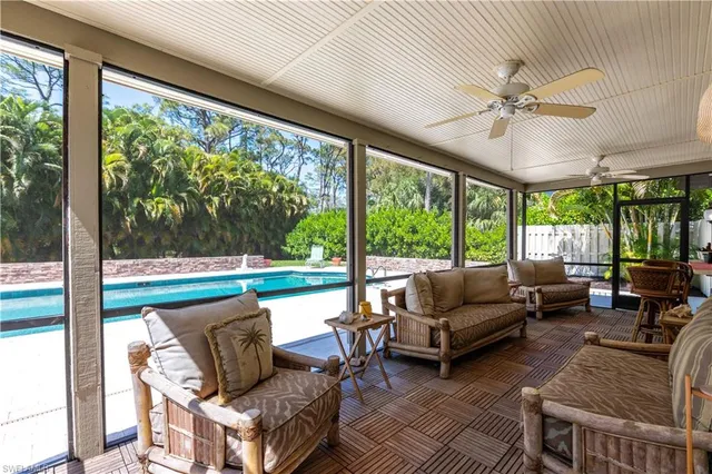 a bedroom with furniture and stairs