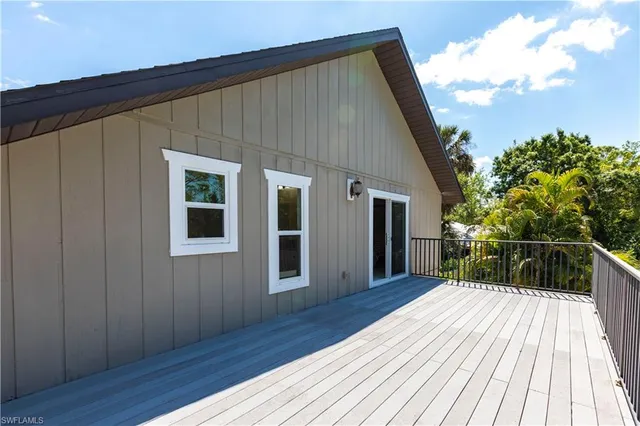 a view of a workspace with furniture and a chandelier