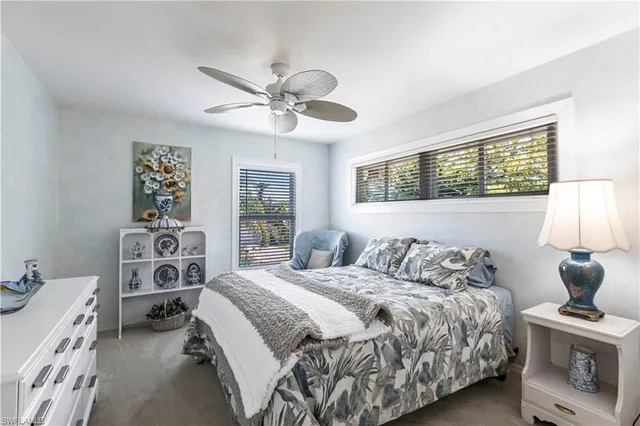 a view of a livingroom with a furniture and ceiling fan