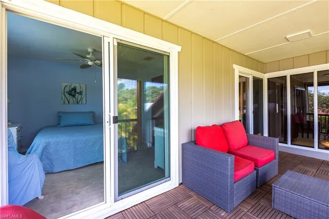 a view of a chair and table in the balcony