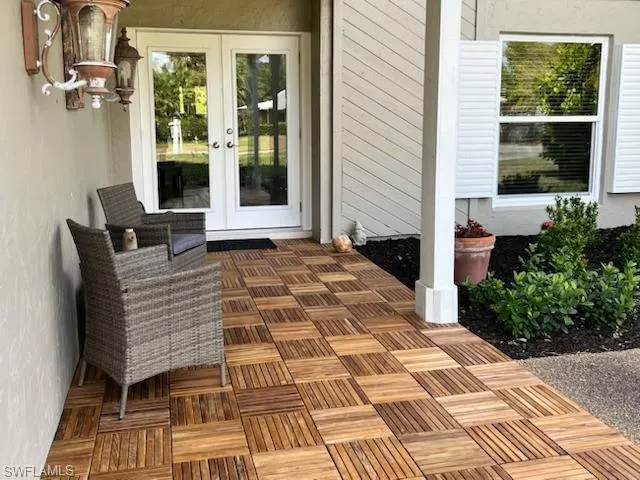 a view of balcony with wooden floor
