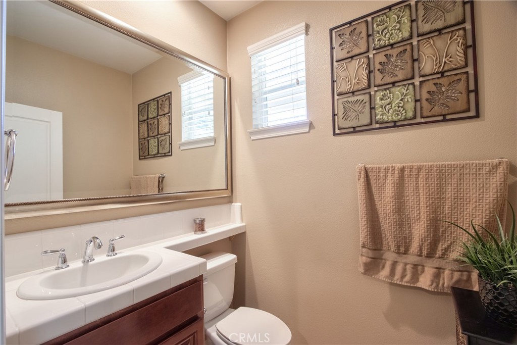 28483 Nautical Point Circle Menifee, CA 92585 - Photo 15 of 44 a bathroom with a sink and a mirror