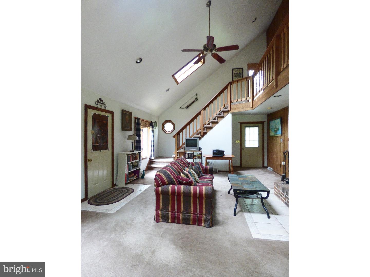 124 Alloway-Woodstown Road Alloway, NJ 08098 - Photo 11 of 25 a living room with furniture and a chandelier