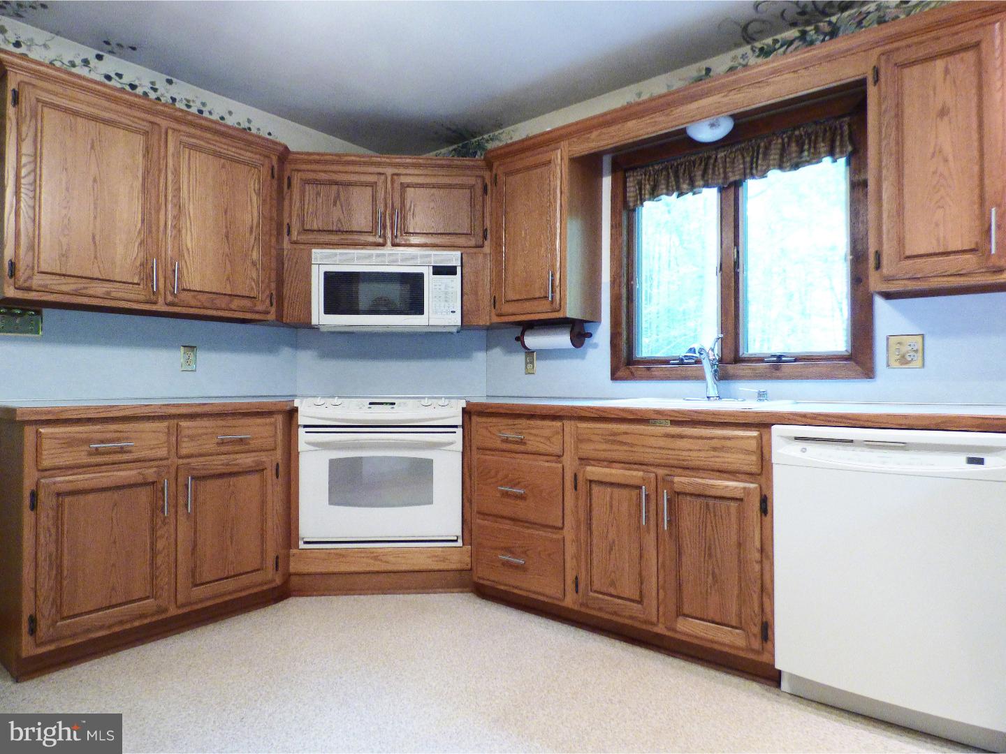 124 Alloway-Woodstown Road Alloway, NJ 08098 - Photo 17 of 25 a kitchen with granite countertop cabinets stainless steel appliances and a window