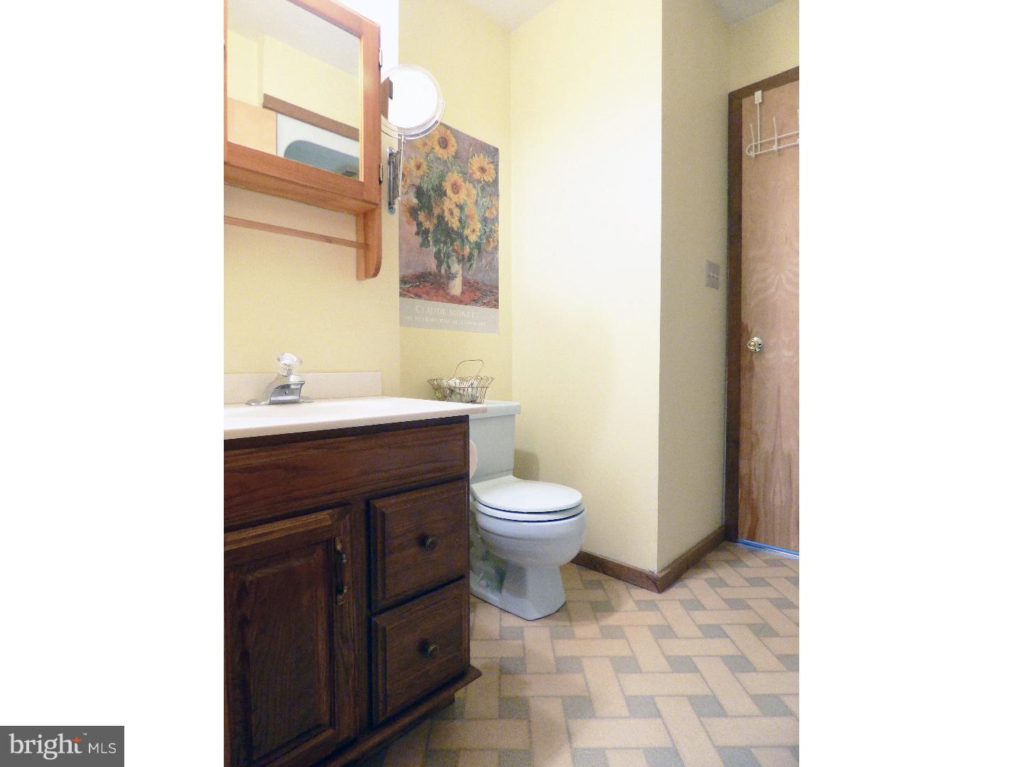 124 Alloway-Woodstown Road Alloway, NJ 08098 - Photo 23 of 25 a bathroom with a toilet a sink and a mirror