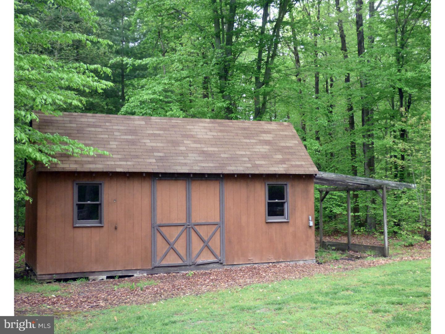 124 Alloway-Woodstown Road Alloway, NJ 08098 - Photo 7 of 25 a backyard of a house with seating space