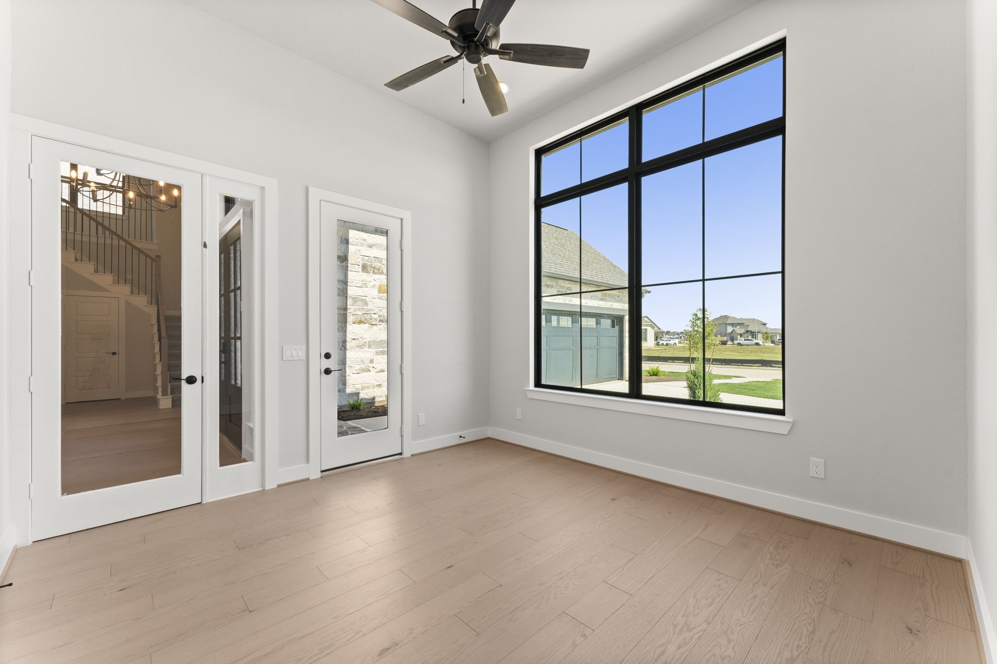 7818 Blue Dasher Pk Place Fulshear, TX 77441 - Photo 15 of 17 Study with front porch entrance.