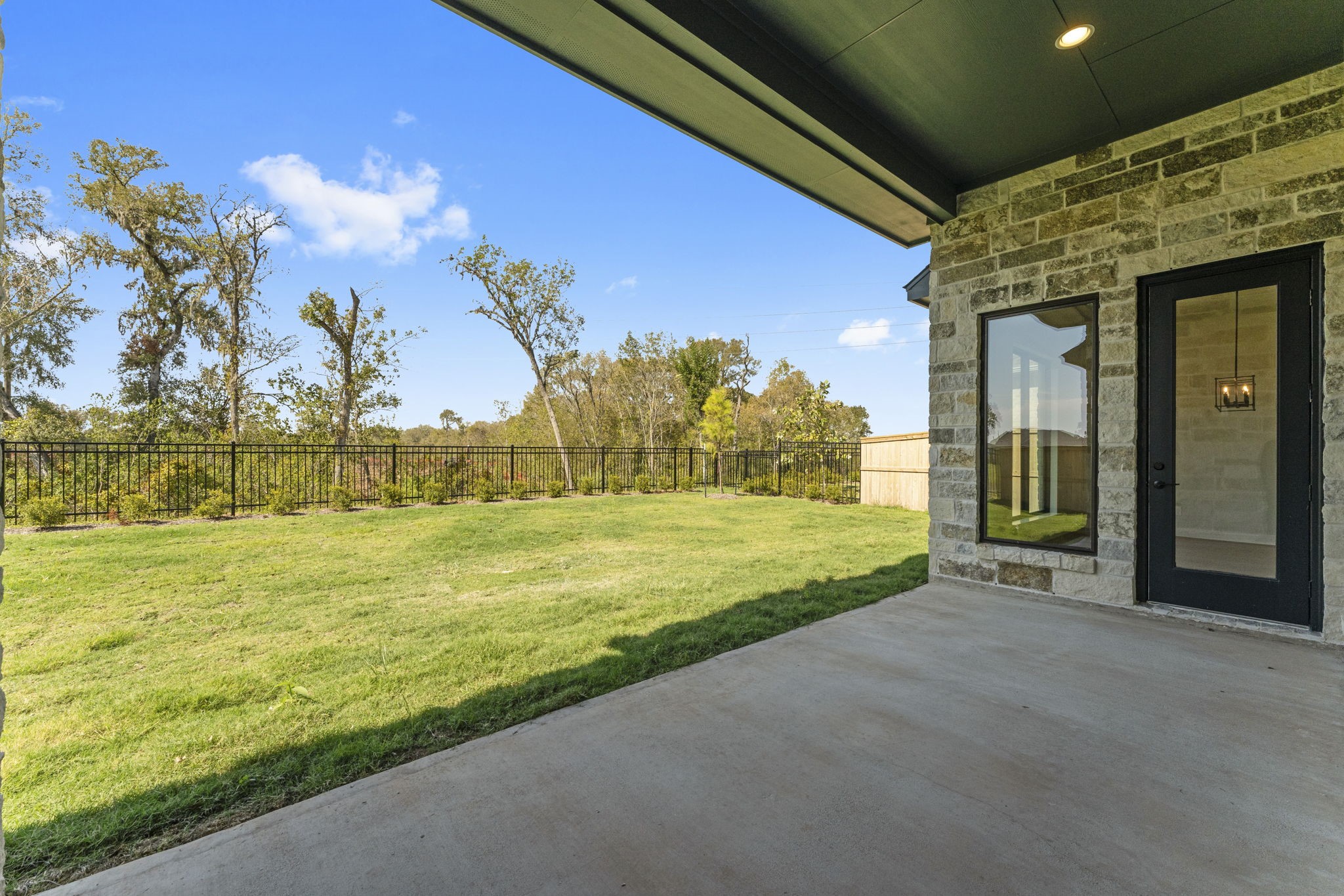 7818 Blue Dasher Pk Place Fulshear, TX 77441 - Photo 16 of 17 Rear covered pati