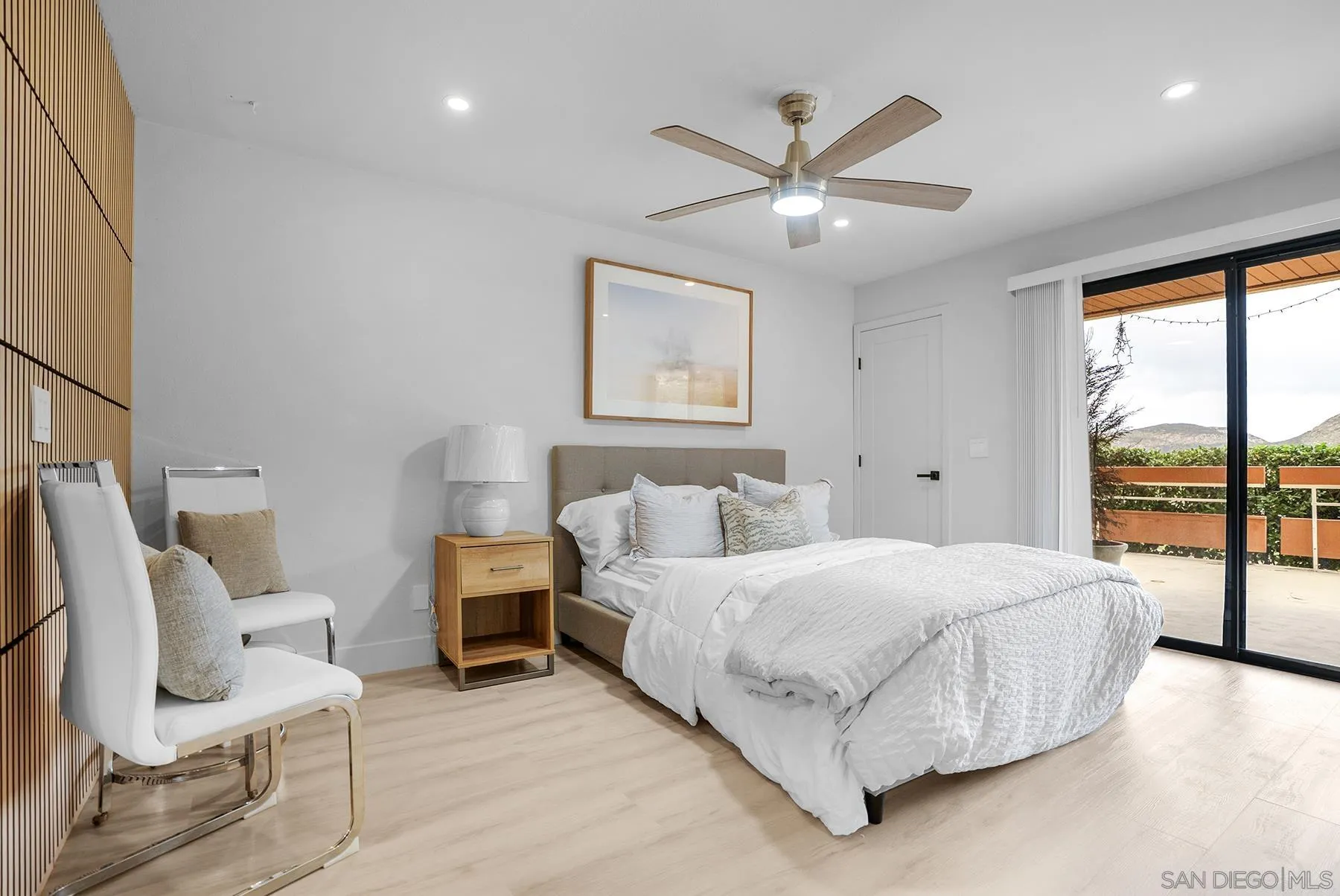 7227 Navajo Road, Unit 103 San Diego, CA 92119 - Photo 12 of 29 a bedroom with a bed and furniture