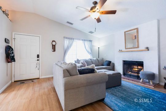 632 South Gordon Street Ridgecrest, CA 93555 - Photo 8 of 30 a living room with furniture and a fireplace