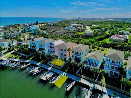 an aerial view of a house with a swimming pool yard and outdoor seating