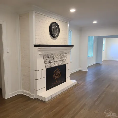 a view of a livingroom with wooden floor