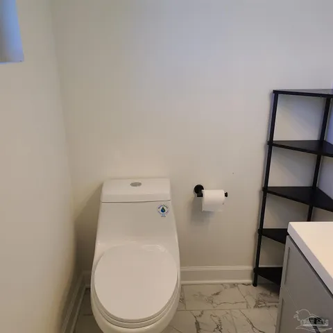 a bathroom with a toilet and a sink