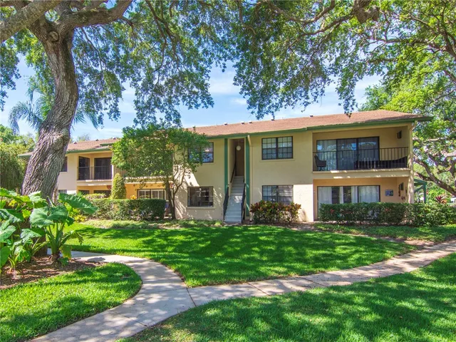 a view of a green field with lots of plants in it