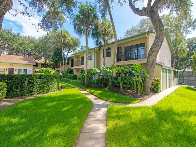a view of a street with a bench in front of it
