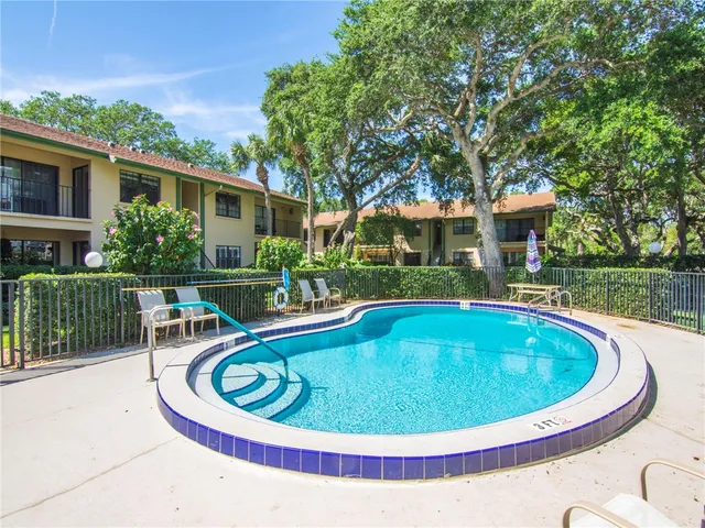 a view of a swimming pool with a patio