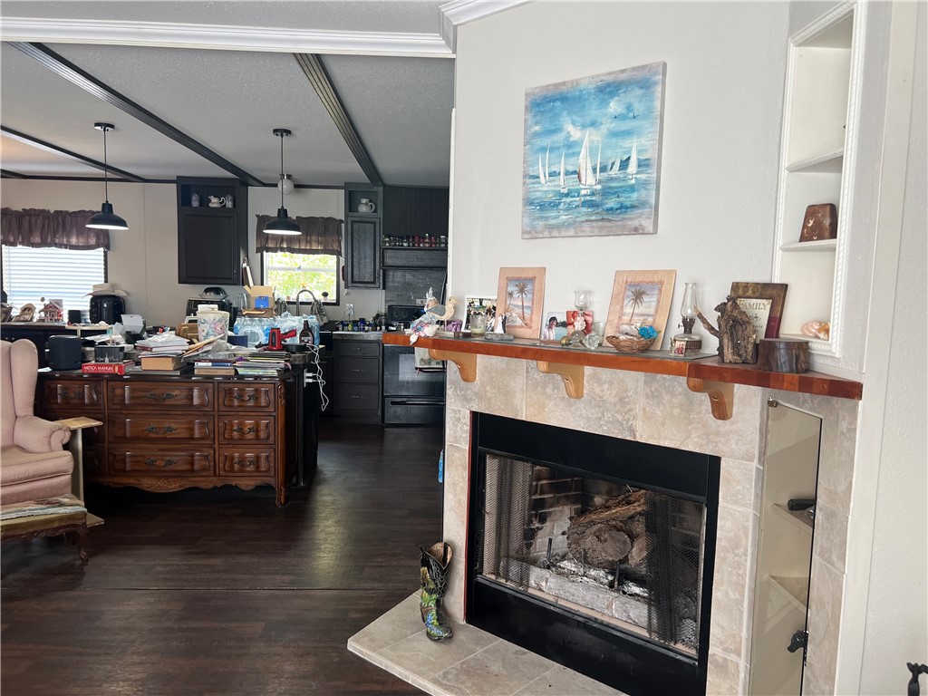 802 1st Street Bayside, TX 78340 - Photo 14 of 22 a living room with furniture and a fireplace