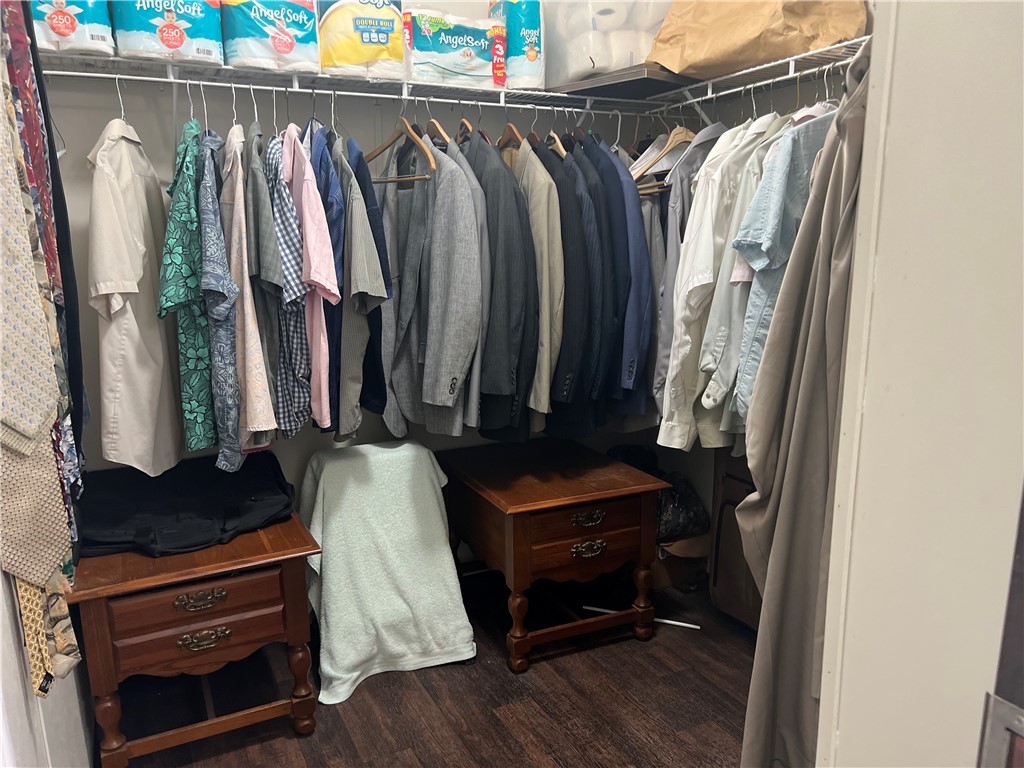 802 1st Street Bayside, TX 78340 - Photo 18 of 22 a view of walk in closet with clothes and shoes