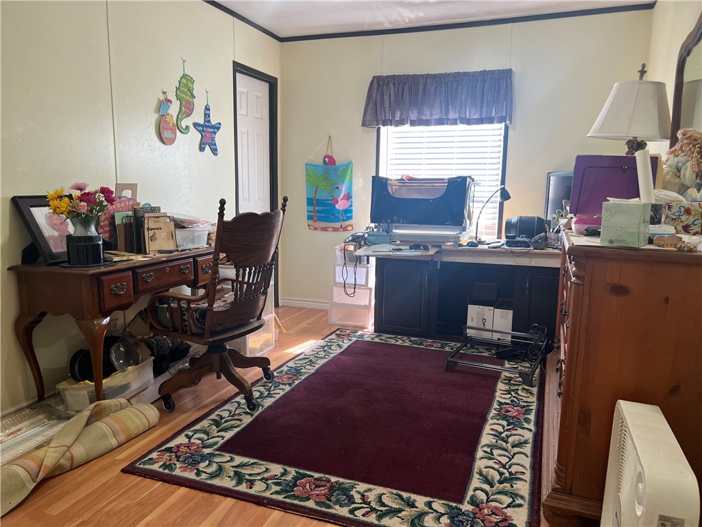802 1st Street Bayside, TX 78340 - Photo 22 of 22 a view of a workspace with furniture and a window