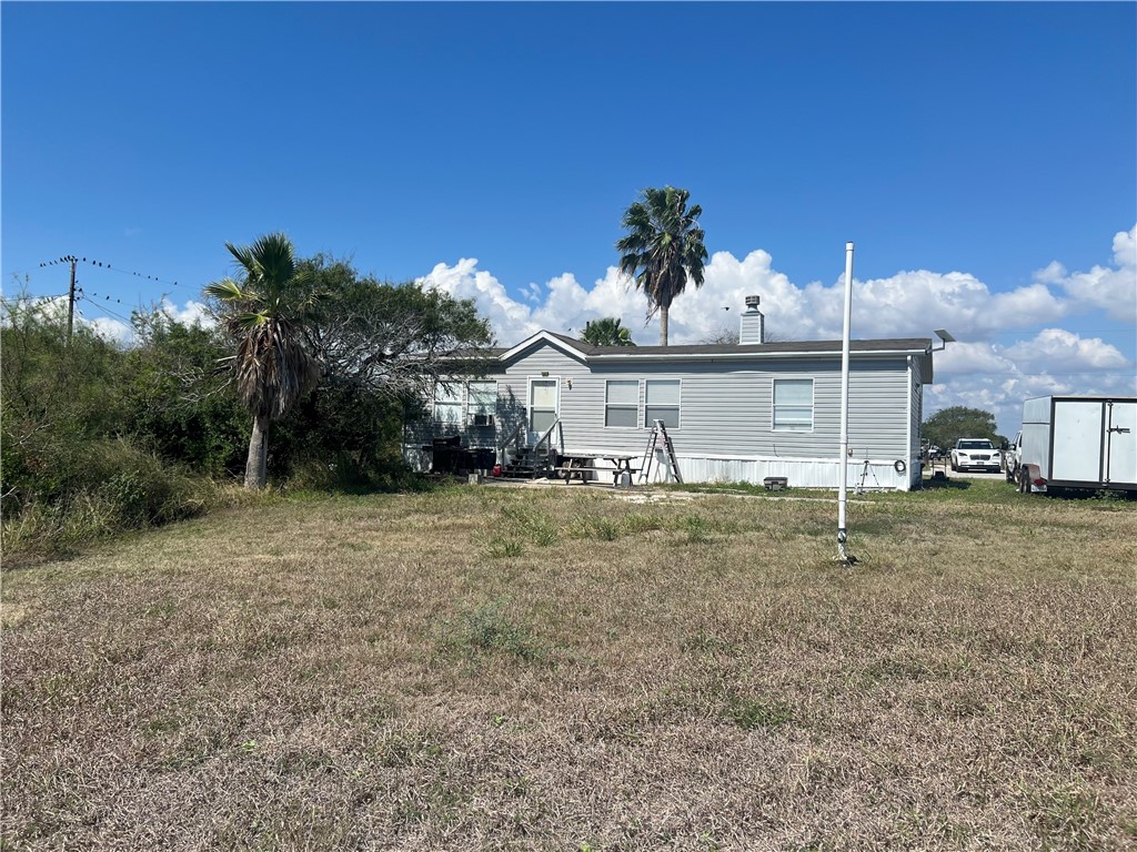 802 1st Street Bayside, TX 78340 - Photo 4 of 22 a view of a house with a backyard