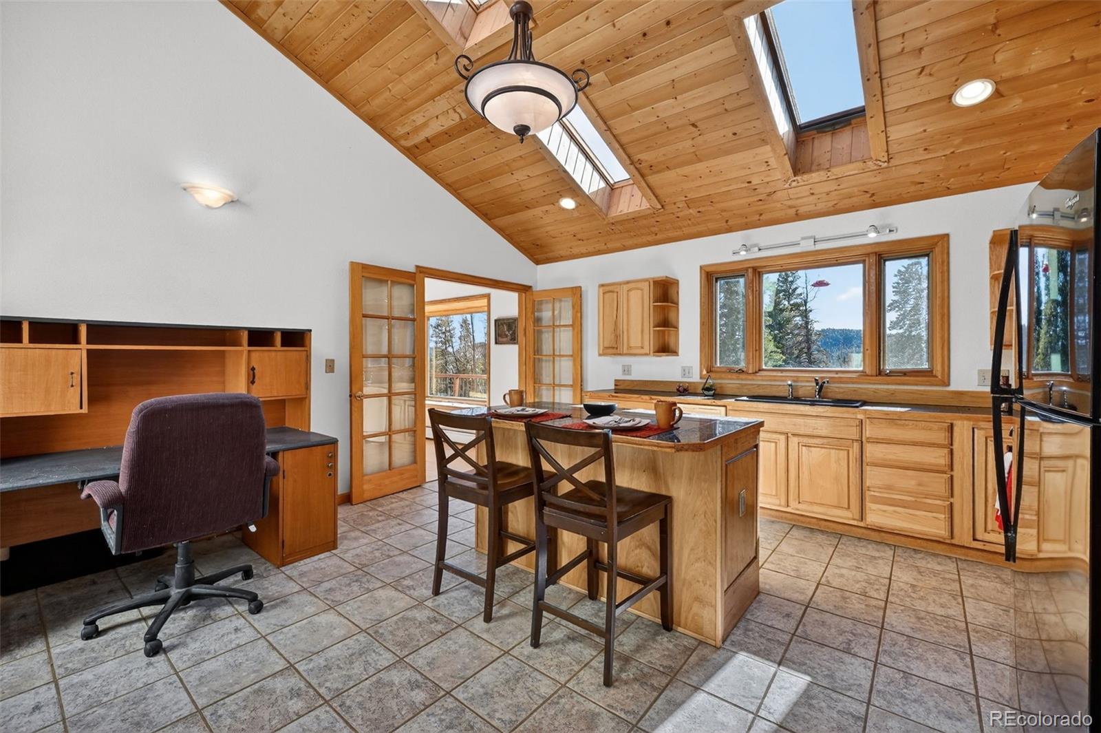 3581 Gap Road Golden, CO 80403 - Photo 12 of 45 a view of a dining room with furniture window and wooden floor