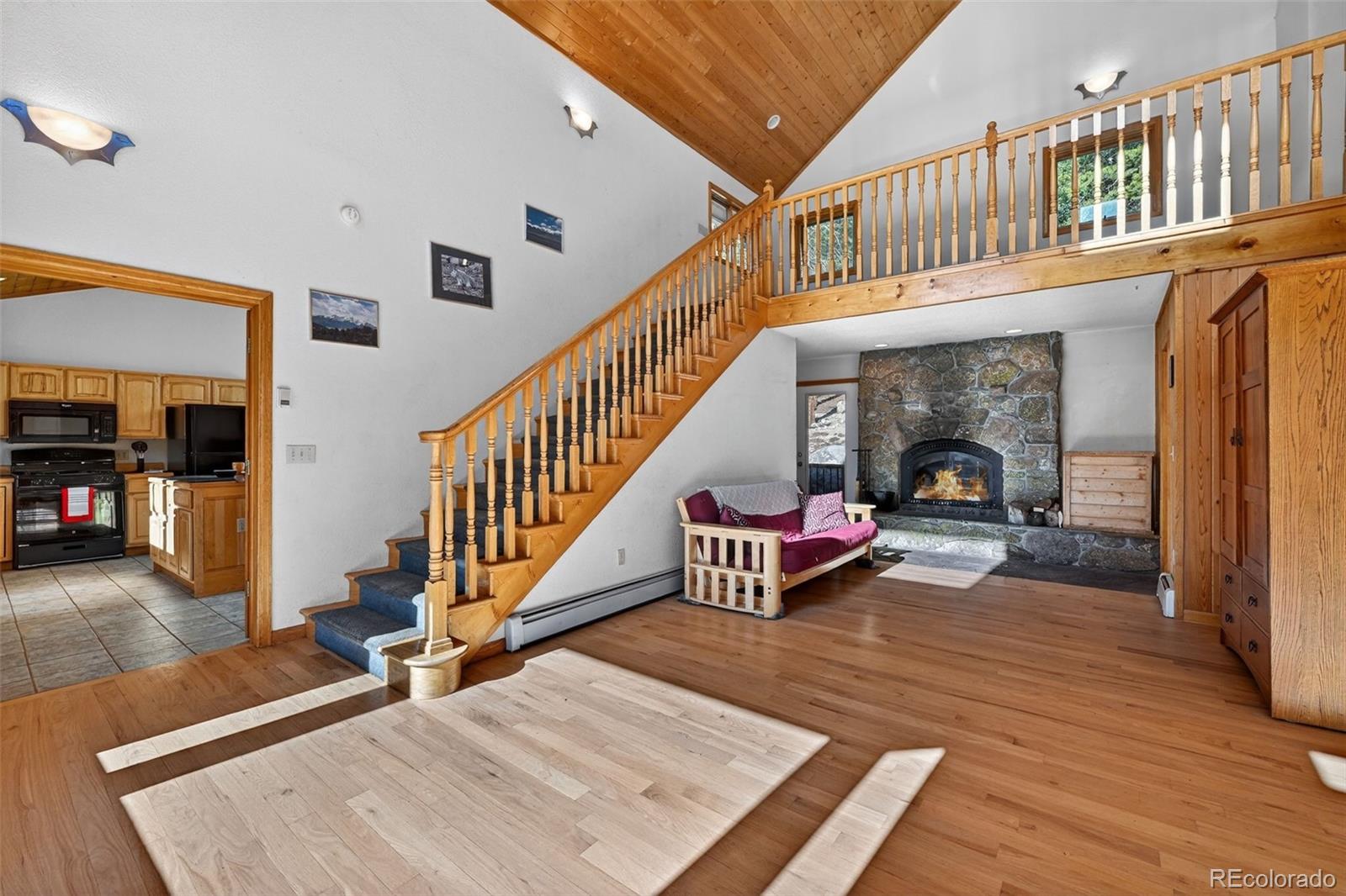 3581 Gap Road Golden, CO 80403 - Photo 2 of 45 a living room with furniture and a wooden floor