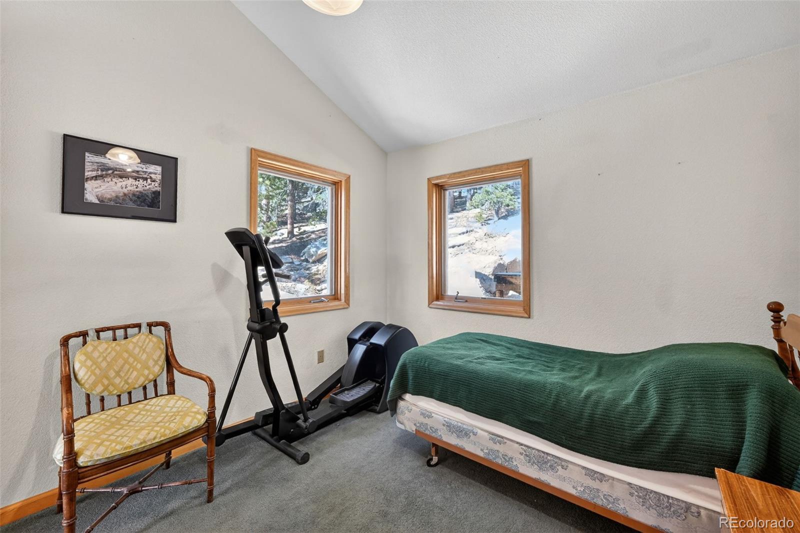3581 Gap Road Golden, CO 80403 - Photo 21 of 45 a bedroom with a bed and two windows