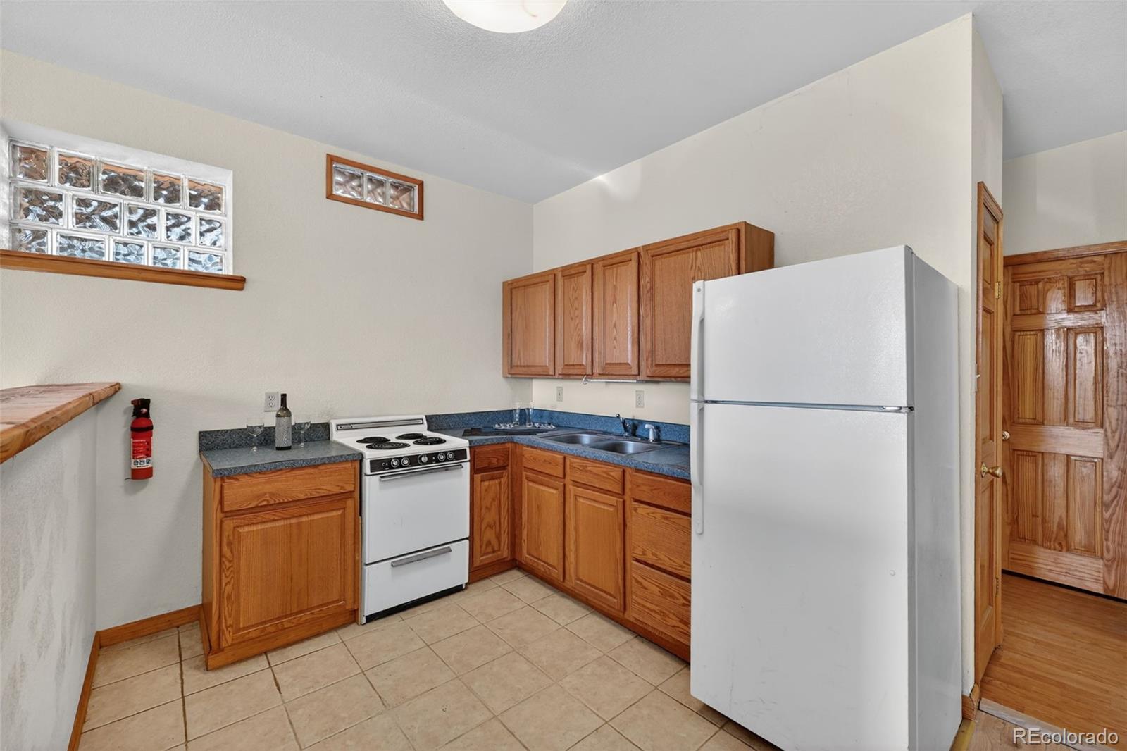 3581 Gap Road Golden, CO 80403 - Photo 26 of 45 a kitchen with stainless steel appliances granite countertop a refrigerator and a stove