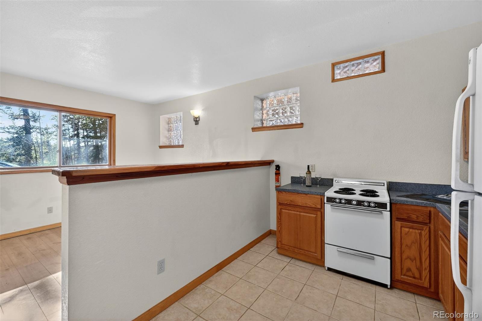 3581 Gap Road Golden, CO 80403 - Photo 27 of 45 a kitchen with a stove and a refrigerator