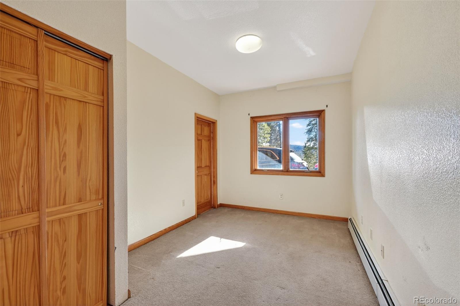 3581 Gap Road Golden, CO 80403 - Photo 28 of 45 an empty room with windows