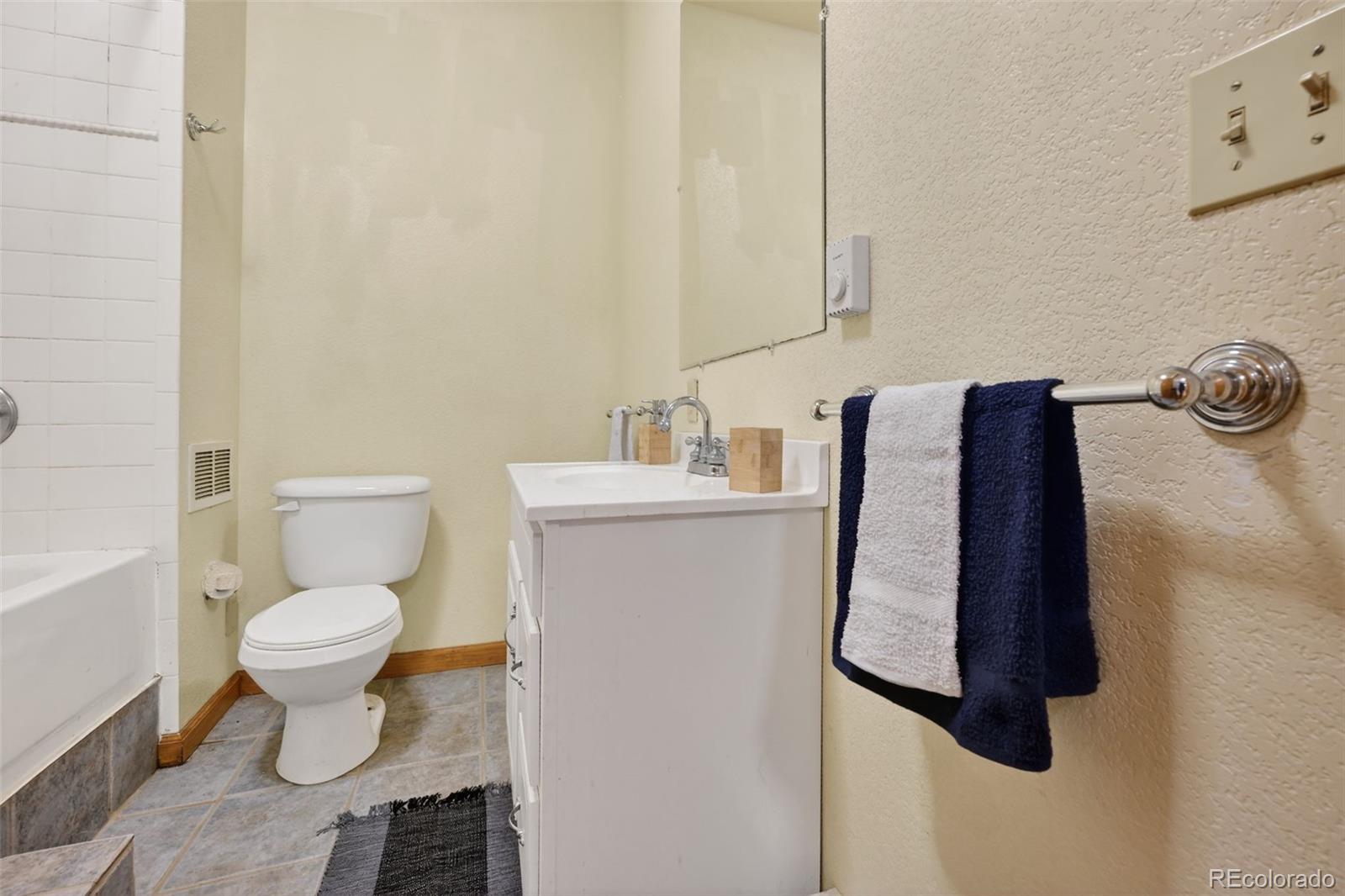 3581 Gap Road Golden, CO 80403 - Photo 31 of 45 a bathroom with a toilet and a sink