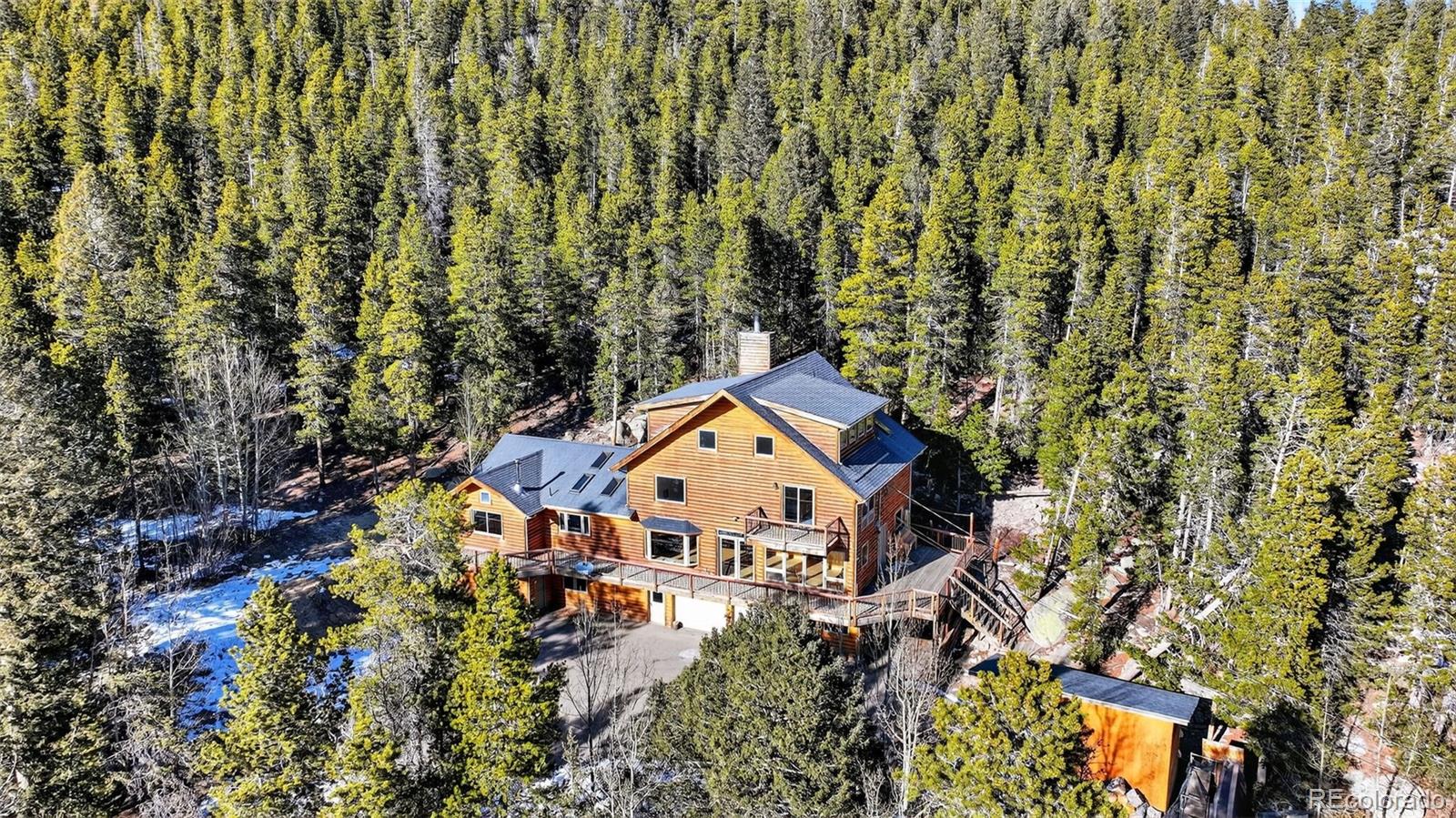 3581 Gap Road Golden, CO 80403 - Photo 37 of 45 an aerial view of a house with a yard and large trees
