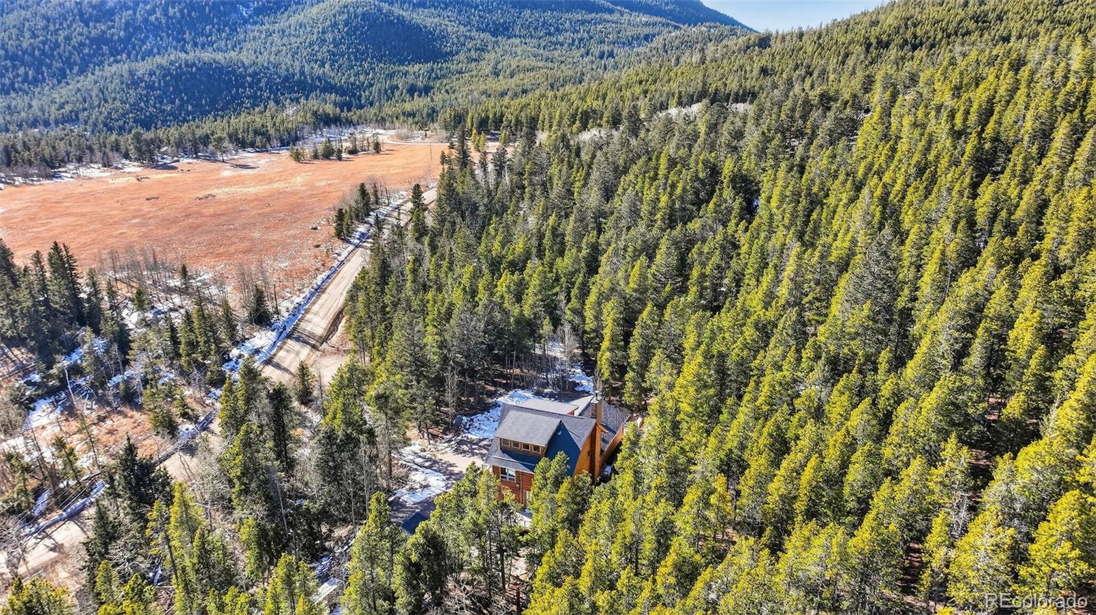 3581 Gap Road Golden, CO 80403 - Photo 39 of 45 a view of a lake with a house