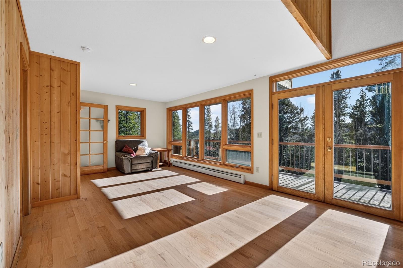 3581 Gap Road Golden, CO 80403 - Photo 4 of 45 a living room with furniture and a floor to ceiling window