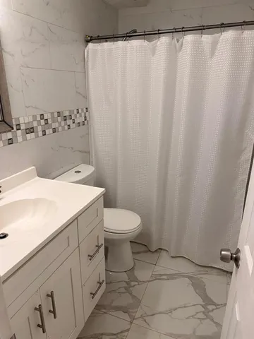 a bathroom with a sink and a toilet