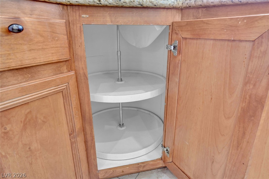 977 Sparkling Light Street Henderson, NV 89052 - Photo 35 of 75 This organized cabinet offers convenient storage with its practical rotating shelves.